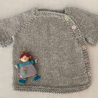 Adorable hand knitted light grey jacket with 6 of the most beautiful little flower side buttons, ages Newborn – 6 months