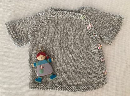 Adorable hand knitted light grey jacket with 6 of the most beautiful little flower side buttons, ages Newborn – 6 months