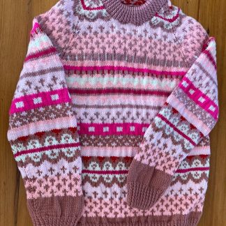 Hand knitted Fair Isle jumper in shades of pink, for very cold days. Round neck Long sleeves Ribbing around neckline, cuffs and hem 100% Acrylic yarn Completed garment measurements: Chest all around: 84cm Length, shoulder to hem ribbing: 59cm Sleeve seam length: 33cm