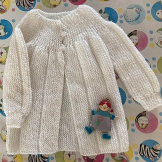 Baby’s jacket hand knitted in softest yarn in white with a yoke in garter stitch 3 pretty flower buttons in front