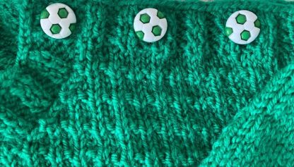 3 Unique white and green soccer ball buttons on one shoulder